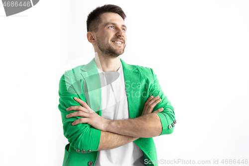 Image of Young dreaming man isolated on white background looking at something