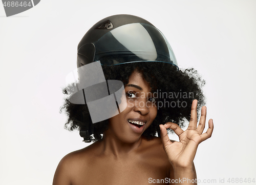 Image of Portrait of attractive woman in motorbike helmet