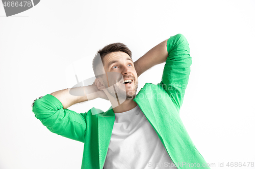 Image of Young dreaming man isolated on white background looking at something