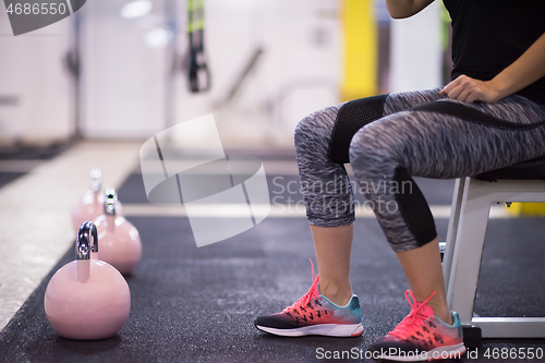 Image of woman exercise with fitness kettlebell