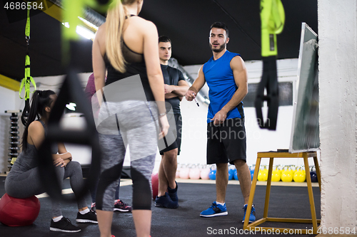 Image of athletes getting instructions from trainer