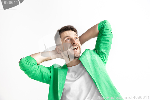 Image of Young dreaming man isolated on white background looking at something