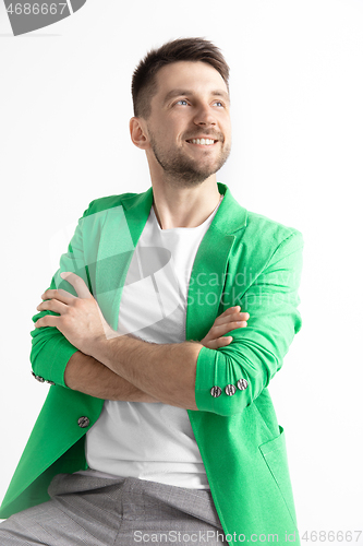 Image of Young dreaming man isolated on white background looking at something