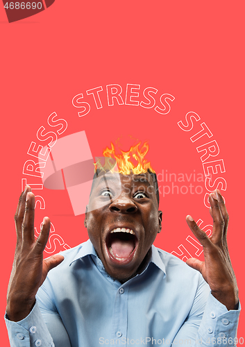 Image of African-american man with fliming head stressed out