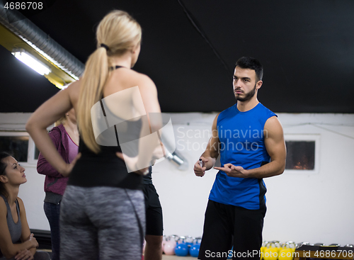 Image of athletes getting instructions from trainer