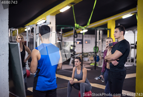 Image of athletes getting instructions from trainer