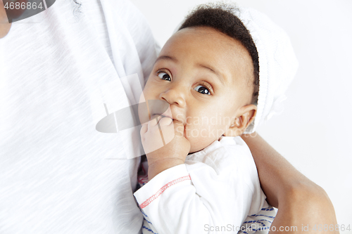 Image of Portrait of beautiful african woman holding on hands her little baby