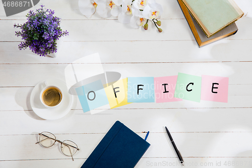 Image of OFFICE. Message at colorful note papers on a desk background.