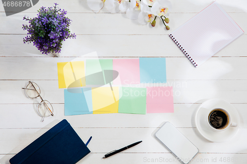 Image of Message at colorful note papers on a desk background.