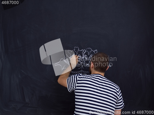 Image of future dad drawing his imaginations on chalk board