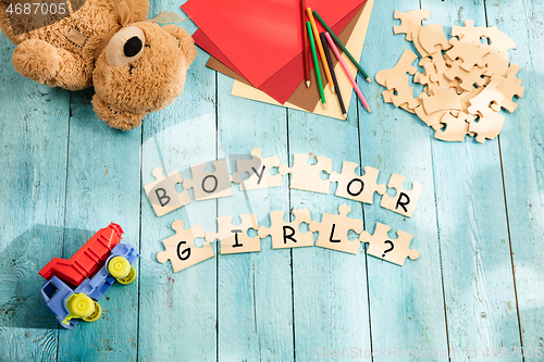 Image of Stationery and words BOY OR GIRL made of letters