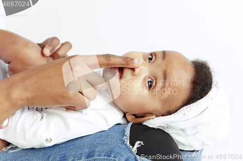 Image of Portrait of beautiful african woman holding on hands her little baby