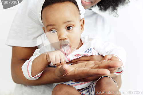 Image of Portrait of beautiful african woman holding on hands her little baby