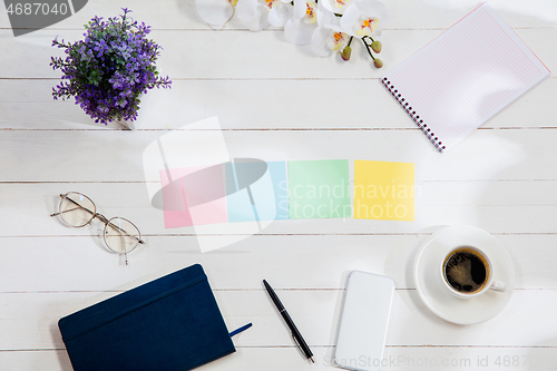 Image of Message at colorful note papers on a desk background.