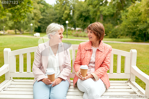 Image of senior women or friends drinking coffee at park