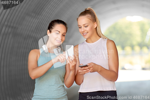 Image of women or female friends with smartphones