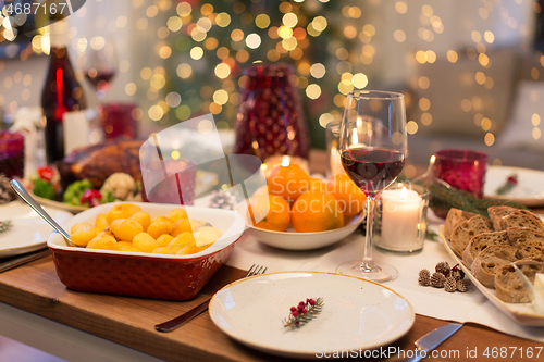 Image of glass of red wine and food on christmas table