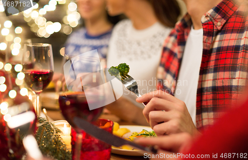 Image of close up of friends having christmas dinner