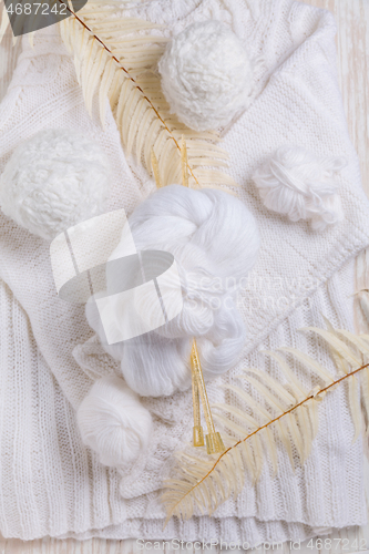 Image of Knitting concept with needles, wool, sweater and yarn