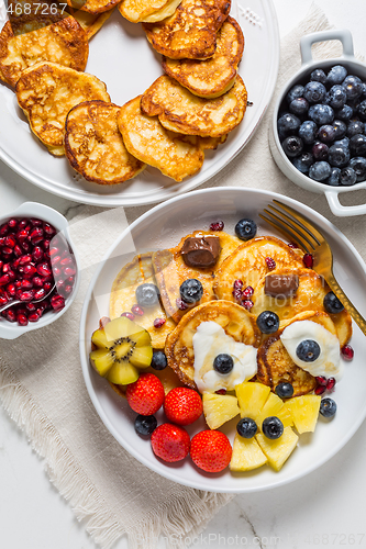 Image of Homemade low calarie curd cheese pancakes with fruit salad