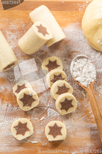 Image of Baking christmas cookies with chocolate star. 