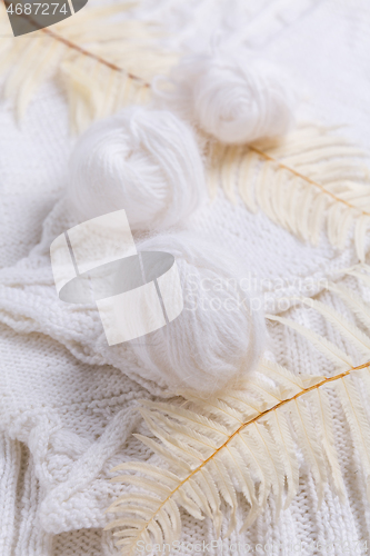 Image of Knitting concept with needles, wool, sweater and yarn