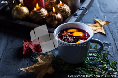 Image of Mulled wine with orange, cinnamon and anise in mug