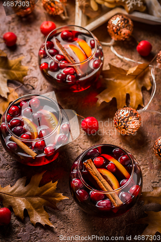 Image of Mulled wine with orange, cranberries and cinnamon and anise 