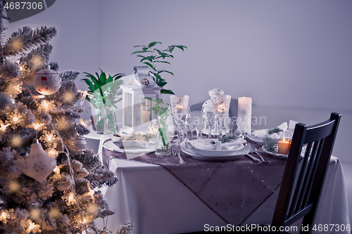 Image of Table setting for celebration Christmas and New Year Holidays. Festive table at home. 