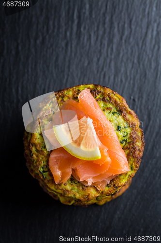 Image of Homemade zucchini pancakes with smoked salmon and lemon