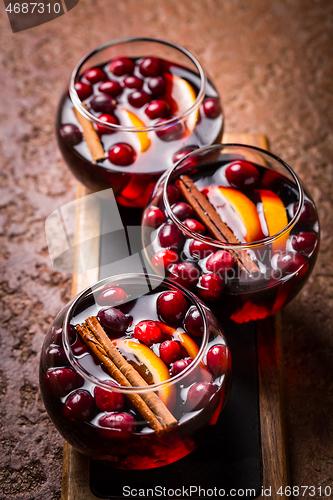 Image of Mulled wine with orange, cranberries and cinnamon and anise 