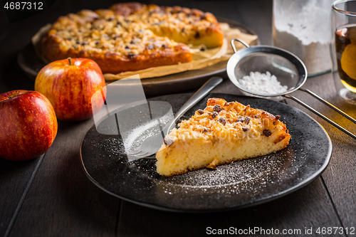 Image of Delicious apple pie with chocolate pieces and ingredients for Thanksgiving