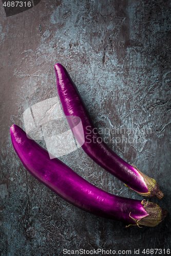 Image of Japanese Eggplants, fresh aubergines on dark background