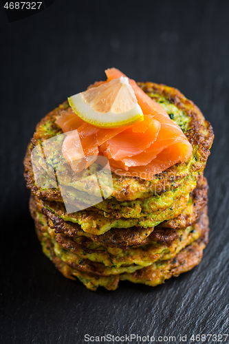 Image of Homemade zucchini pancakes with smoked salmon and lemon