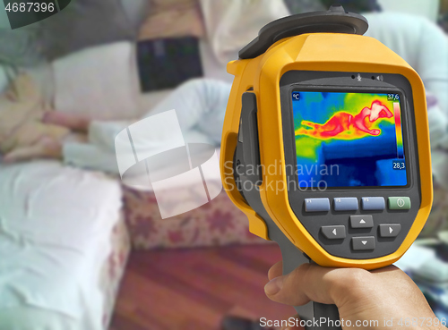 Image of Recording with thermal camera Young woman is lying on the bed