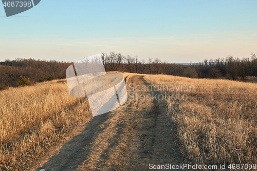 Image of Countriside dirt road landscape, pale autumn