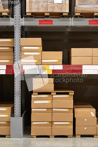 Image of Warehouse stocked with boxes in stacks