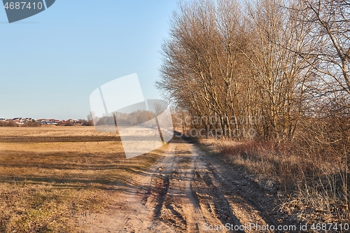 Image of Countriside dirt road landscape, pale autumn