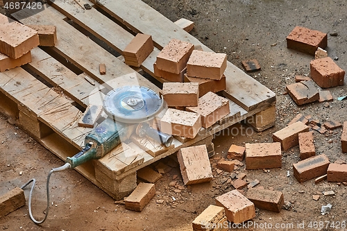 Image of Brick House Construction, Cutting bricks