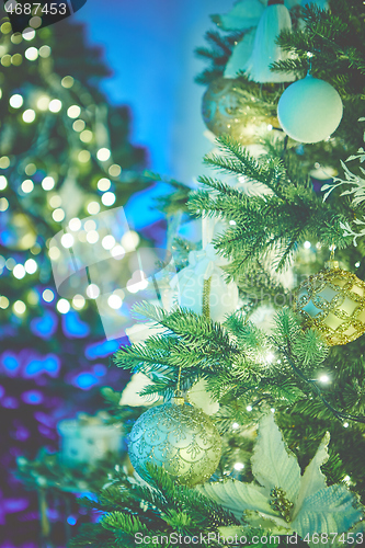 Image of Closeup of Christmas tree decorations. Selective focus with retro faded colors