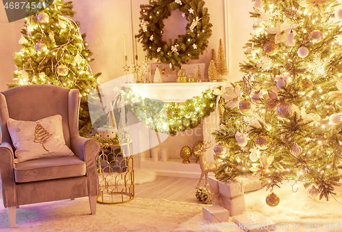 Image of Beautiful Christmas interior decoration for family celebration with pine tree, armchair, fireplace