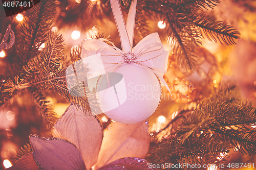 Image of Closeup of Christmas tree decorations. Selective focus with retro faded colors