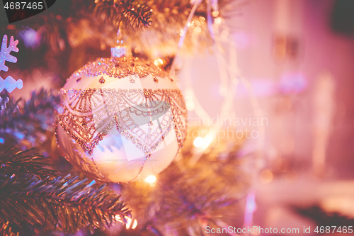 Image of Closeup of Christmas tree decorations. Selective focus with retro faded colors