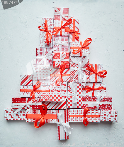 Image of Colorful Christmas tree formed from different various pattern and size boxed gifts