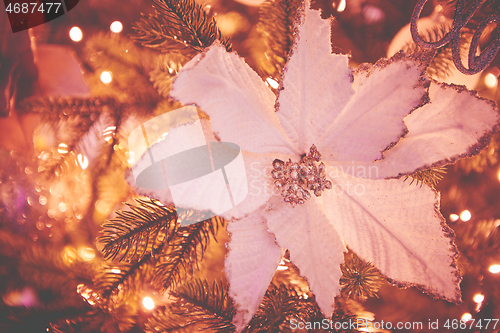 Image of Colorful christmas ornaments and decorations hanging from christmas tree