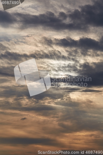 Image of Sunset through cloudy dramatic sky