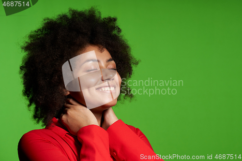 Image of Closeup of pleased African-American girl smiling enjoying with closed eyes