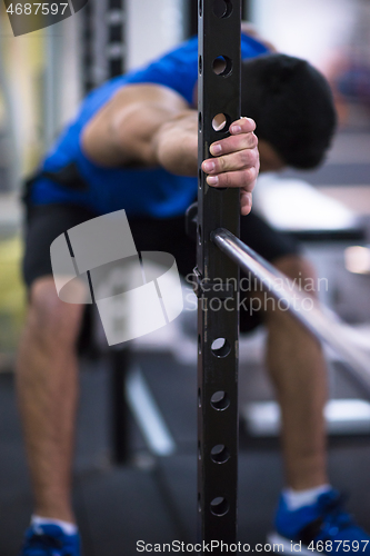 Image of man doing pull ups on the vertical bar