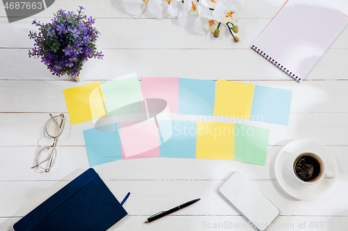 Image of Message at colorful note papers on a desk background.