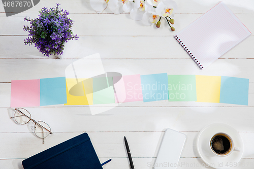 Image of Message at colorful note papers on a desk background.